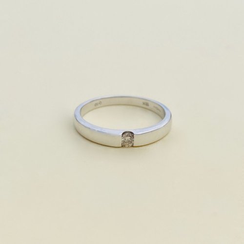 18ct. White Gold Channel Set Single Diamond Ring.