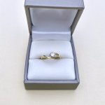 9ct. Gold Diamond Solitaire Crossover Ring.