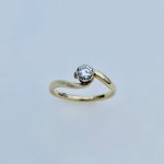 9ct. Gold Diamond Solitaire Crossover Ring.